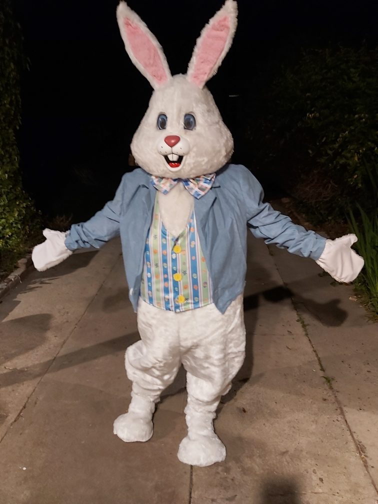 The Easter Bunny in a blue jacket and vest