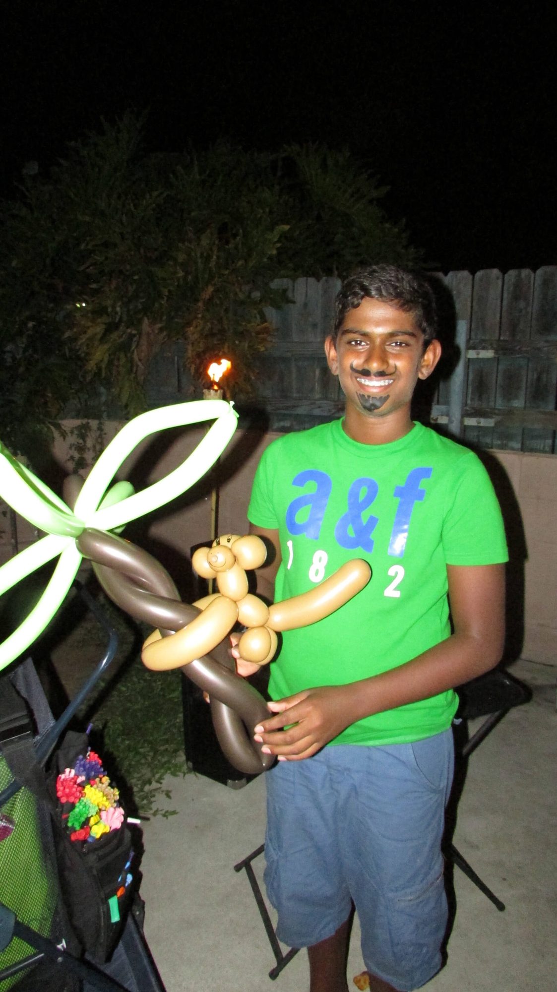 A birthday guest with a balloon monkey creation