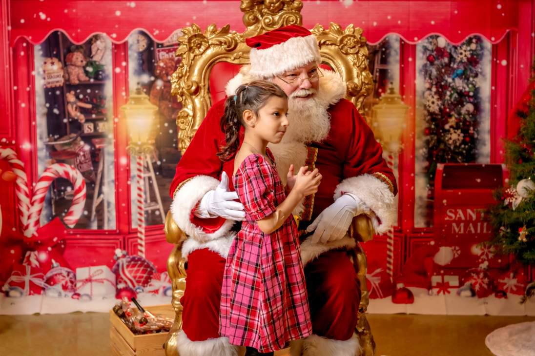 Santa Claus posing with a family