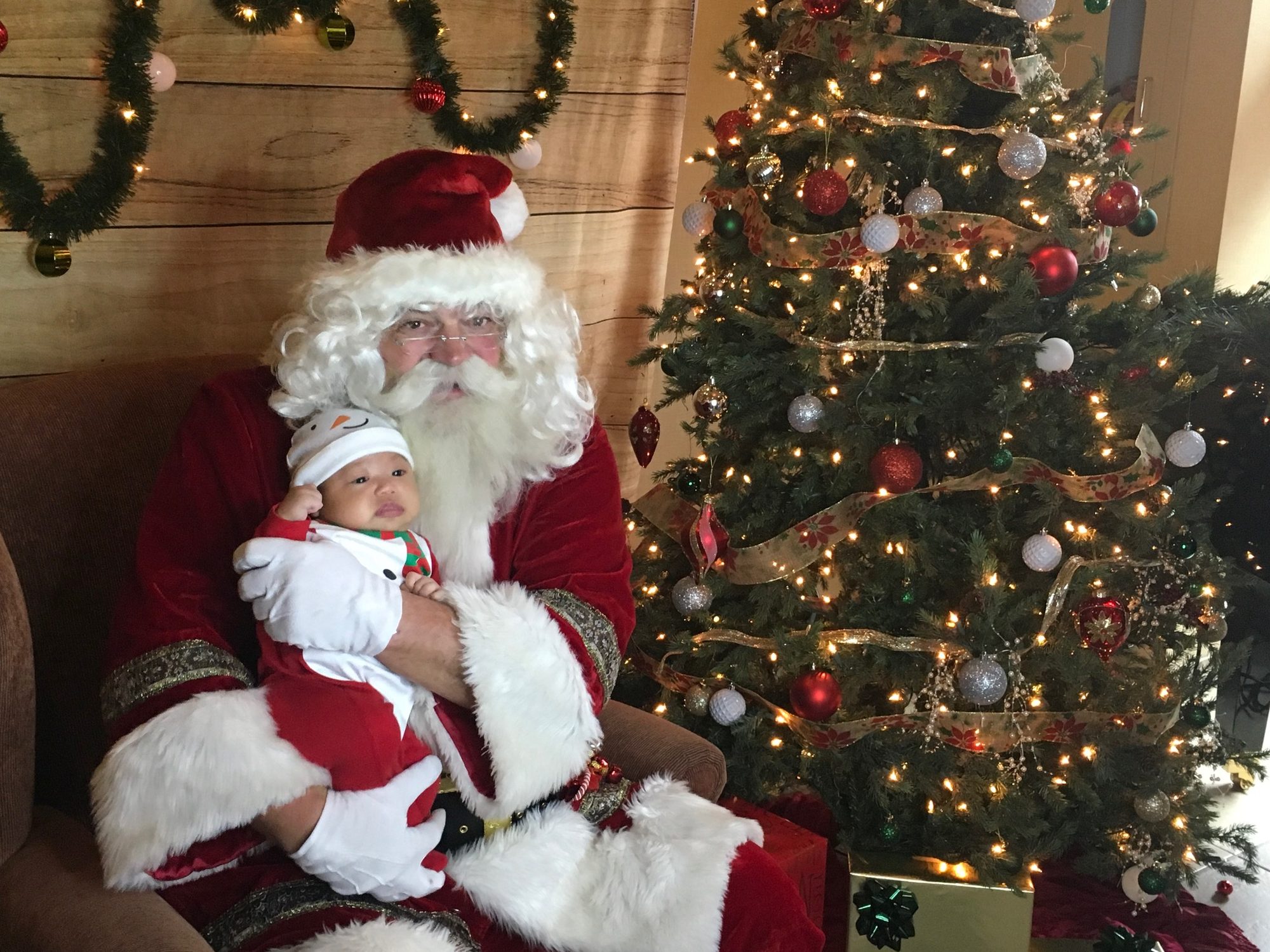 Santa Claus posing with a family