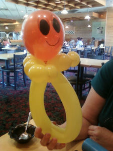 A Face Shape Balloon With a Smile on Balloon
