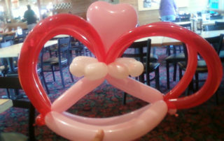 A Heart Shape Balloon Made in Red and Pink Color