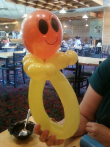 An Orange Color Smile Figure With a Yellow Body