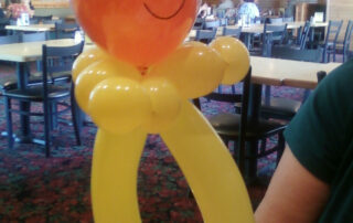 An Orange Color Smile Figure With a Yellow Body