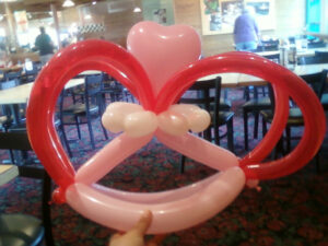 A Red and Light Pink Color Balloon Shaped Piece