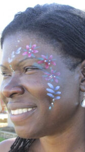 A Woman With a String of Flowers Painting