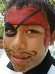 A Little Boy With a Pirate Style Face Painting
