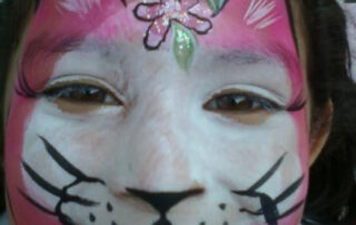 A Little Girl With a Cat Shape Face Painting