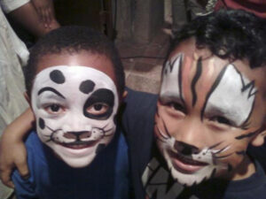 Two Little Boys With Tiger Themed Face Painting