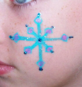 A Snow Flake Pattern With Stone in Blue Color