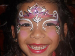 The Face of a Little Girl With Face Painting Done