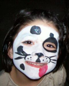 A Face With a Cat Type Face Painting in White and Black