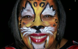 The Front of a Face With Tiger Themed Painting