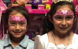 Two Little Girls With Face Painting on forehead