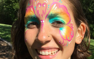 The Face of a Woman With a Butterfly Painting