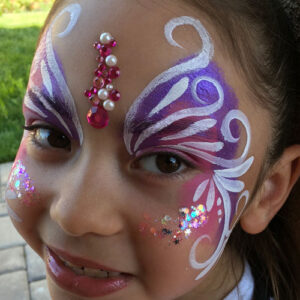 A Girl With a Butterfly Themed Painting on Both Sides