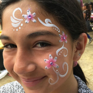 A Little Girl With Three Flower Pattern Painting