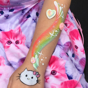 A Rainbow Wave With Hello Kitty Figure on Hand