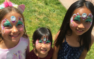 Three Little Girls With Face Painting Done