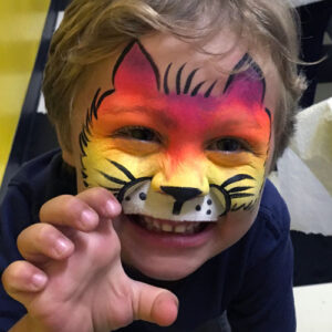 A Little Boy With a Tiger Face Painting