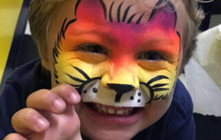 A Little Boy With a Tiger Face Painting