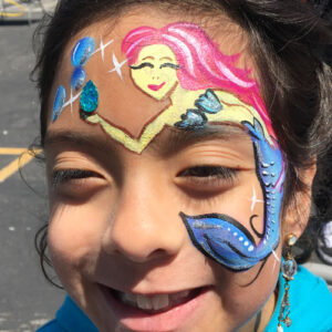 A Girls Face With a Mermaid Figure Painting