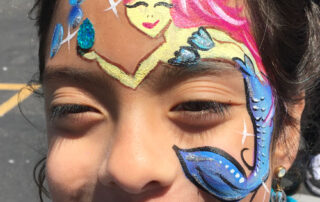 A Girls Face With a Mermaid Figure Painting