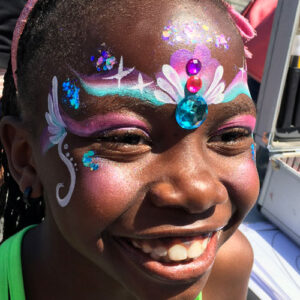 A Woman With Winds on Eyes Painting With Beads