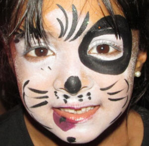 A Little Boy With a White Tiger Face Painting