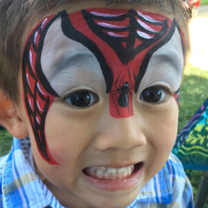 A Little Boy With a Spider Web Painting