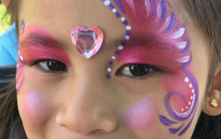 The Side of a Face With a Wing Shape Face Painting